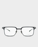Black eyeglasses on a light gray background